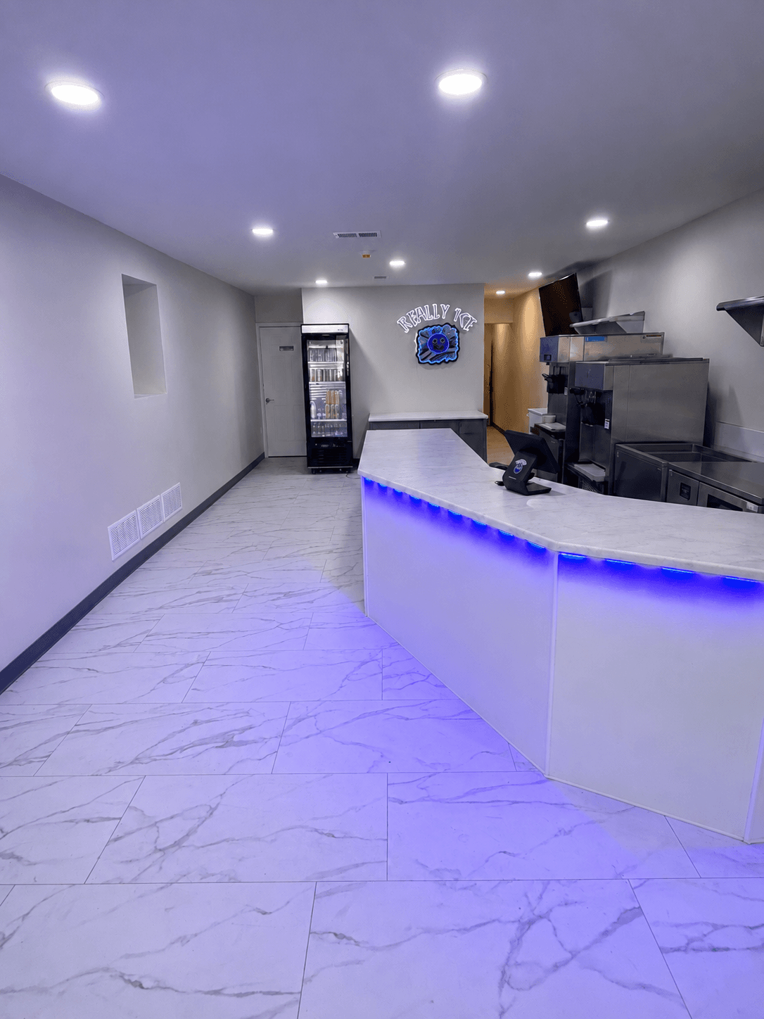 The Really Ice shop interior with the purple-lit counter
